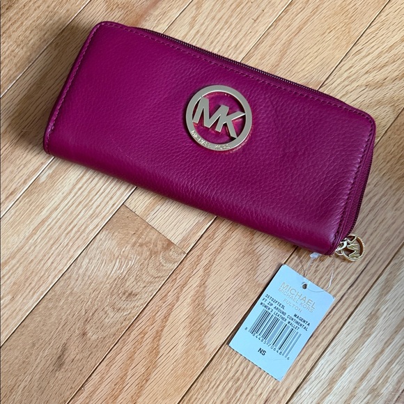 Michael Kors Handbags - Michael Kors Fuchsia Leather Wallet with Gold Logo